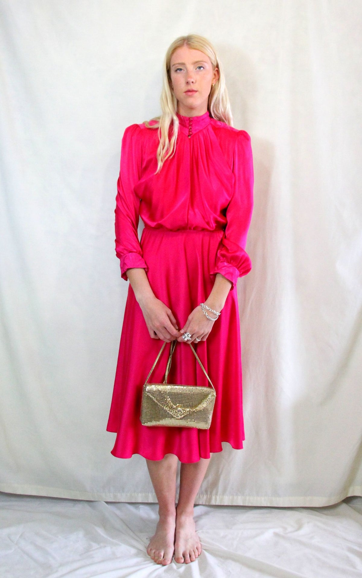 Rent Vintage 1940's style midi dress in fuchsia pink material high neck with matching buttons.