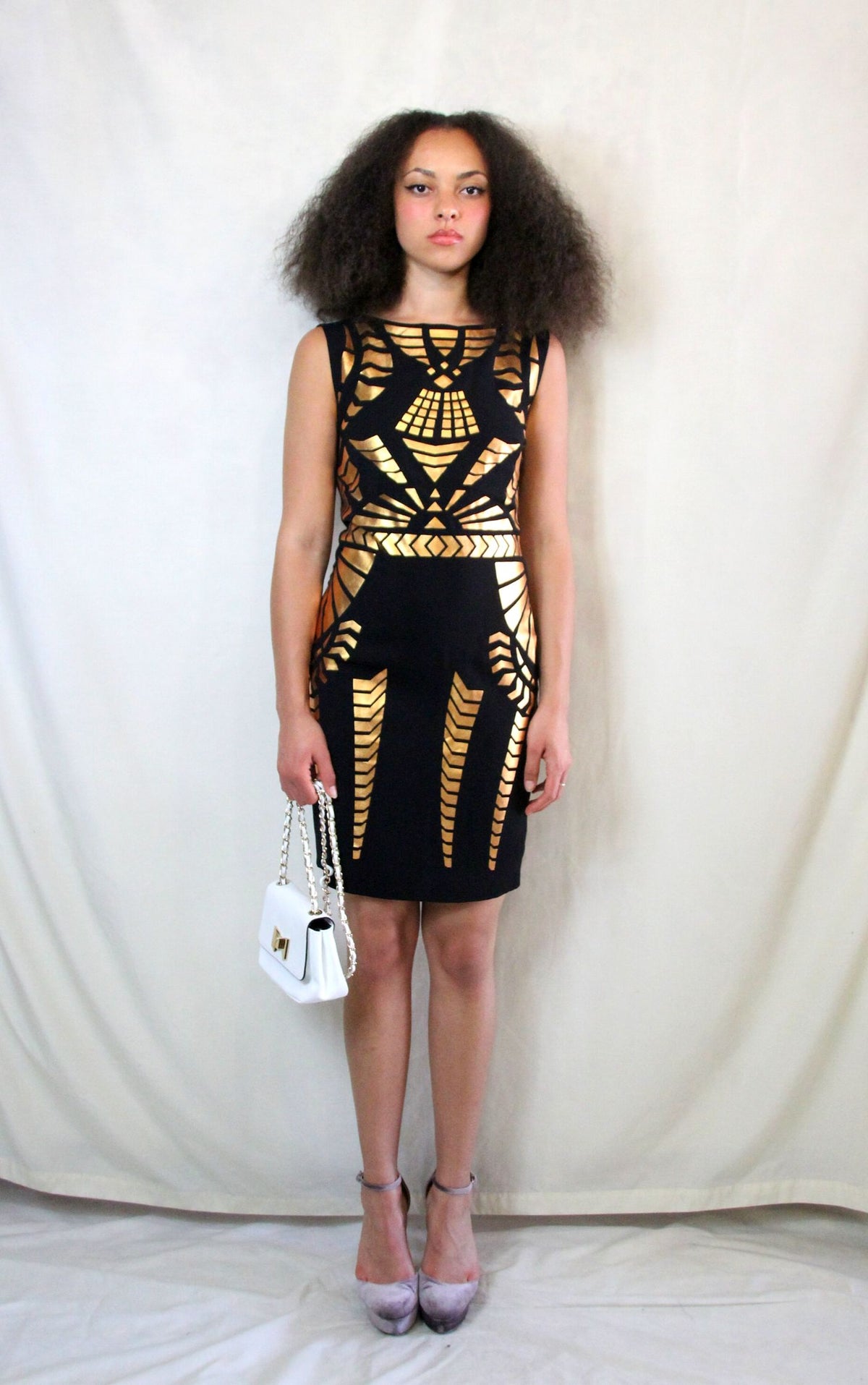Rent Black pencil dress with gold gladiator print and back zip
