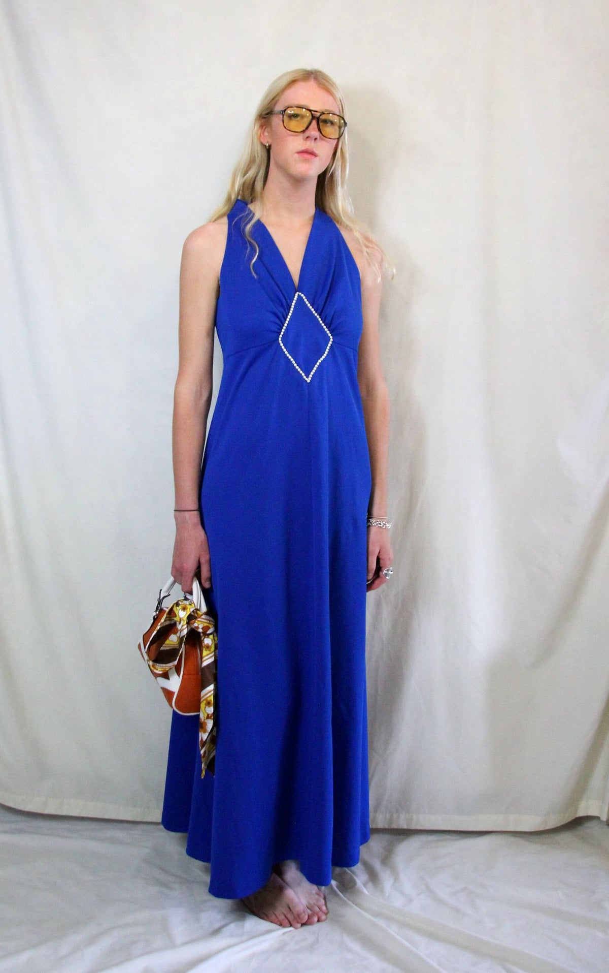 Rent vintage 1970's cobalt blue maxi dress with front pearl detail and back zip