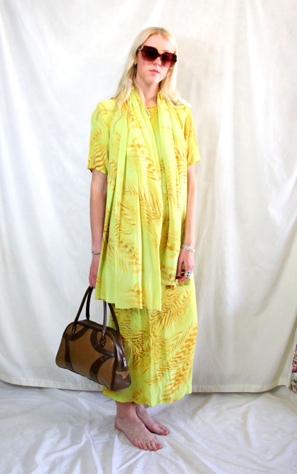 Rent vintage yellow printed three piece outfit. Skirt, top and matching scarf