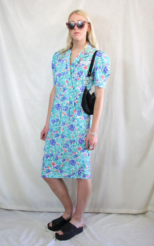 Rent 1950's floral Vintage midi wrap dress in aqua blue, pink and white floral print
