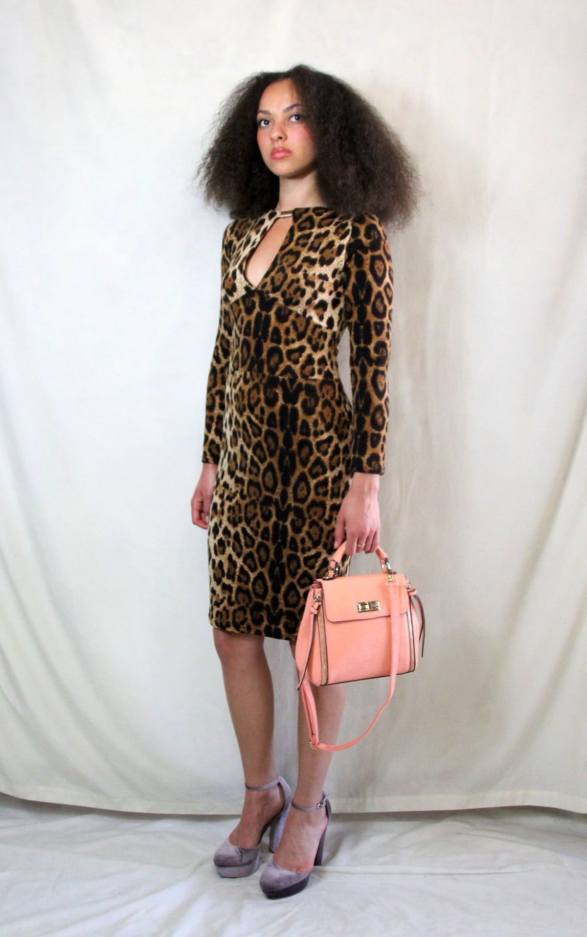 Knitted leopard print pencil dress with long sleeves and back zip