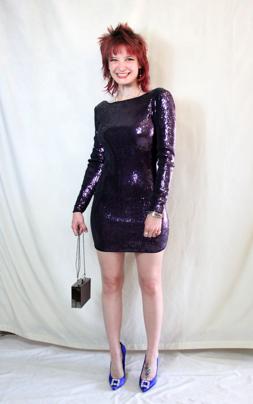 Disco style purple sequin mini body con dress with long sleeves and subtle built in shoulder pads