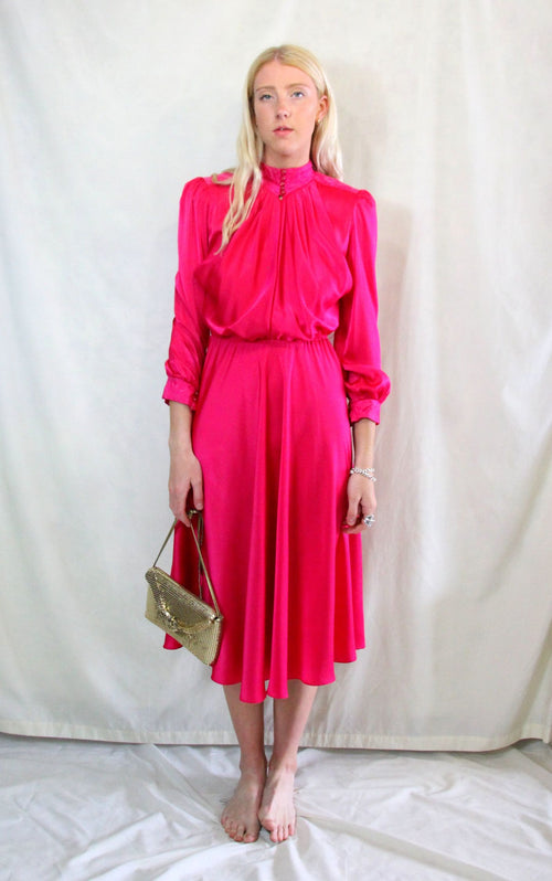 Rent Vintage 1940's style midi dress in fuchsia pink material high neck with matching buttons.