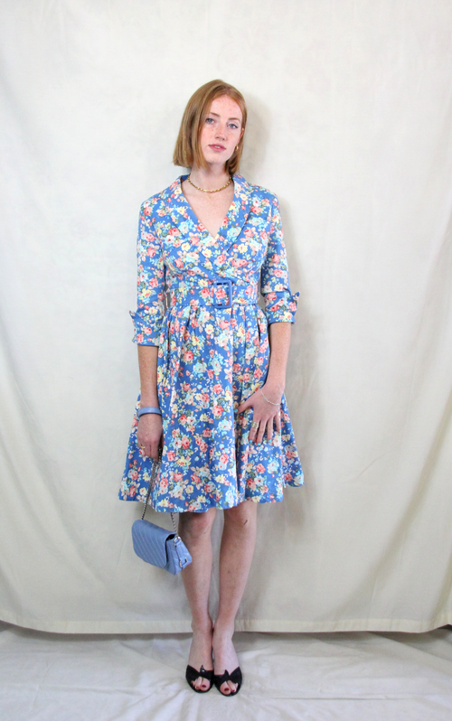 Rent floral sky blue print 1950's style tea dress with matching waist belt. 