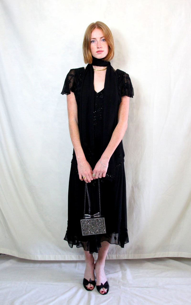 Rent vintage chiffon black Gatsby dress with 1920s modern day finish and matching scarfRent vintage chiffon black Gatsby dress with 1920s modern day finish and matching scarf