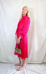 Rent Vintage 1940's style midi dress in fuchsia pink material high neck with matching buttons.