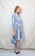 Rent floral sky blue print 1950's style tea dress with matching waist belt. 