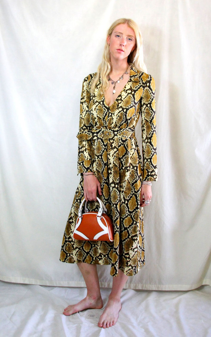 Rent 70's inspired snake print dress with matching belt
