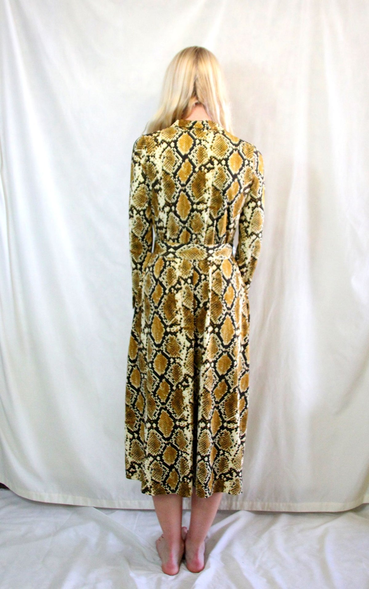 Rent 70's inspired snake print dress with matching belt