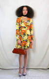 Rent orange floral print 70s style dress with back zip and waist belt. Balloon sleeves