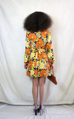 Rent orange floral print 70s style dress with back zip and waist belt. Balloon sleeves