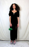 Rent Couture Vintage black maxi dress with sweetheart neckline and structured shoulders. Back zip and subtle split finished off with a delicate and timeless front pearl style brooch 