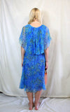 Rent Vintage 1940's style turquoise blue printed dress with front flapper and cape style neck and sleeves. Zips at back 