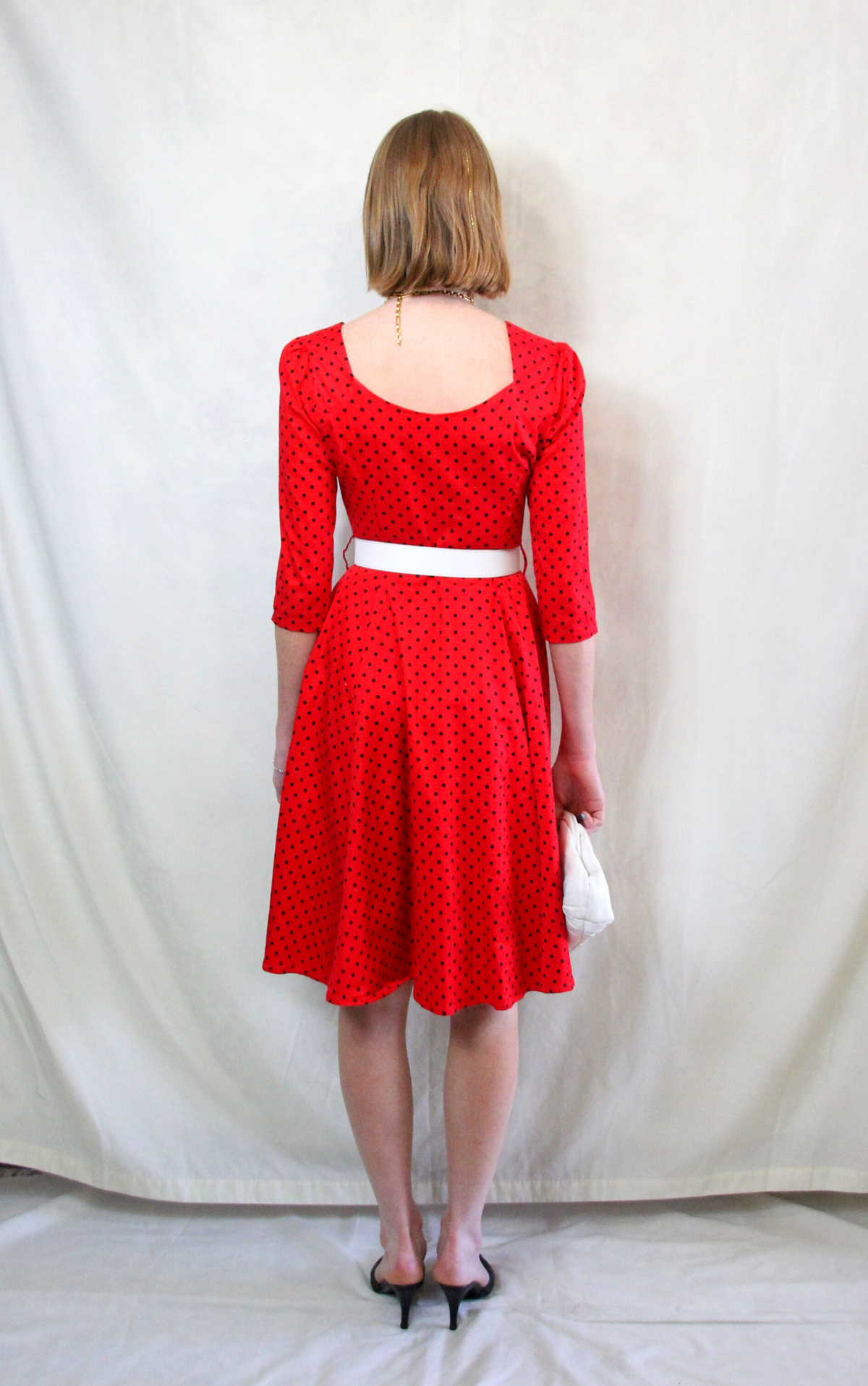 Rent 1950s swing dress in bright red and navy spot print