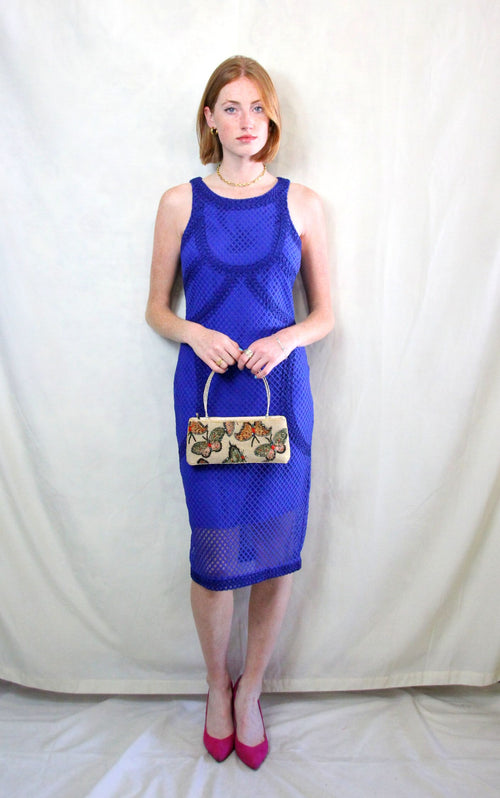 Rent cobalt blue midi caged dress in body con fit with back zipper to close 