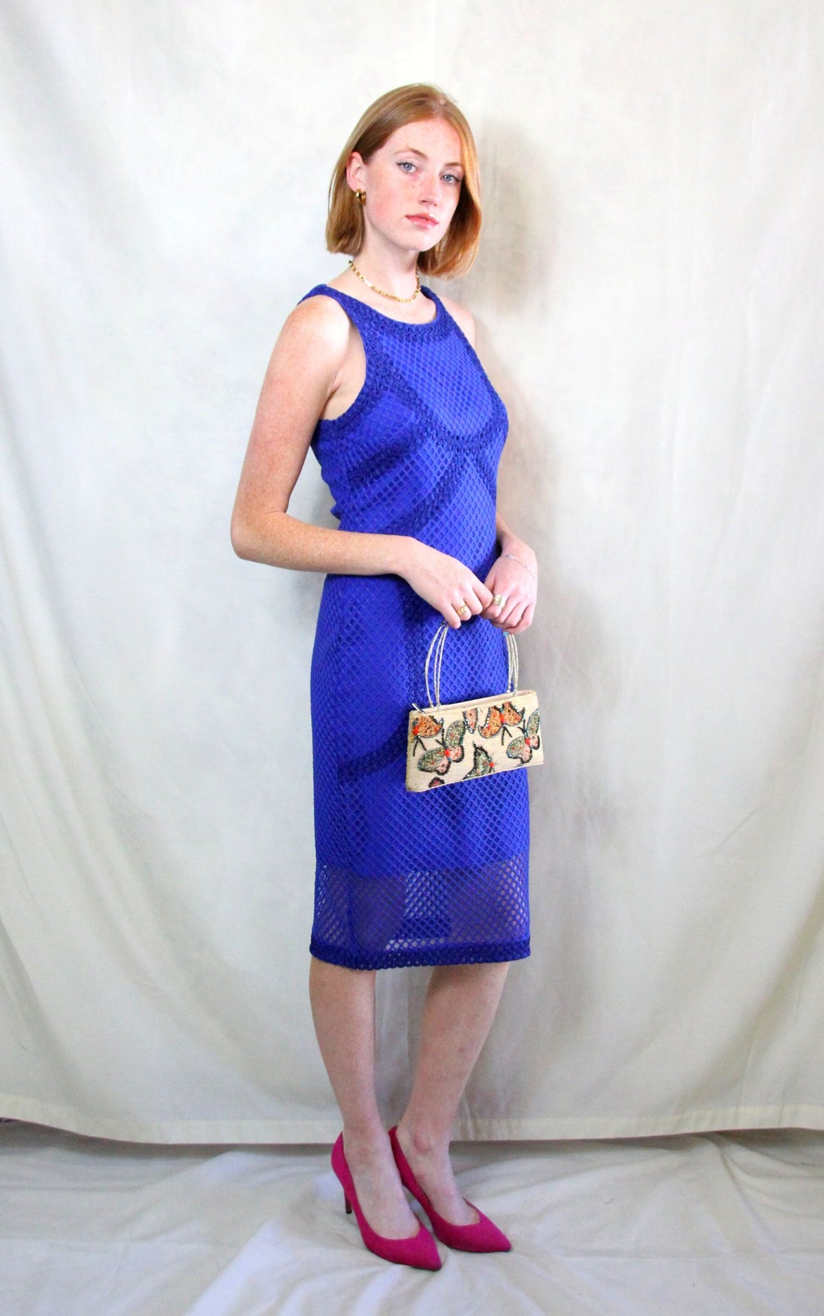 Rent cobalt blue midi caged dress in body con fit with back zipper to close 