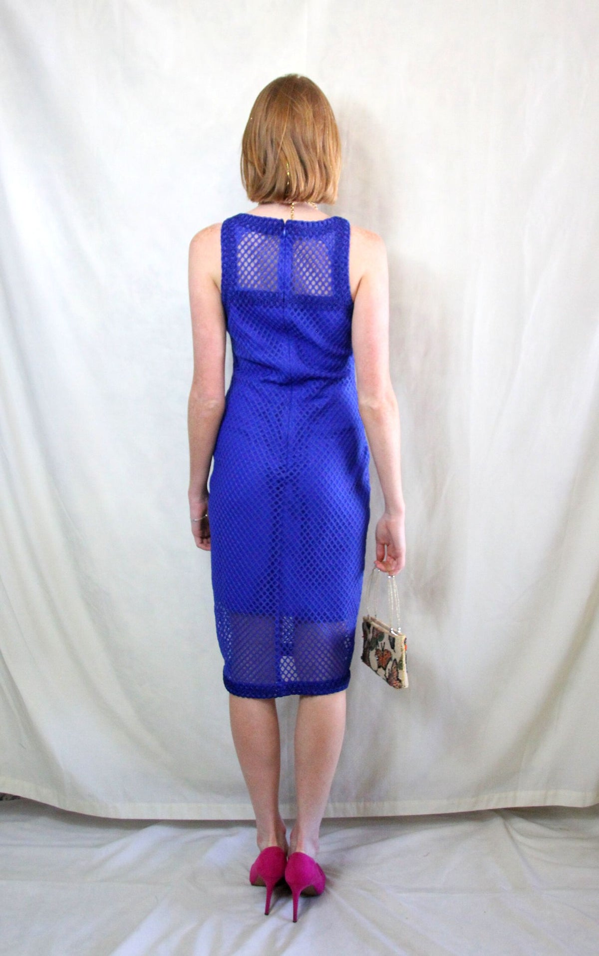 Rent cobalt blue midi caged dress in body con fit with back zipper to close 