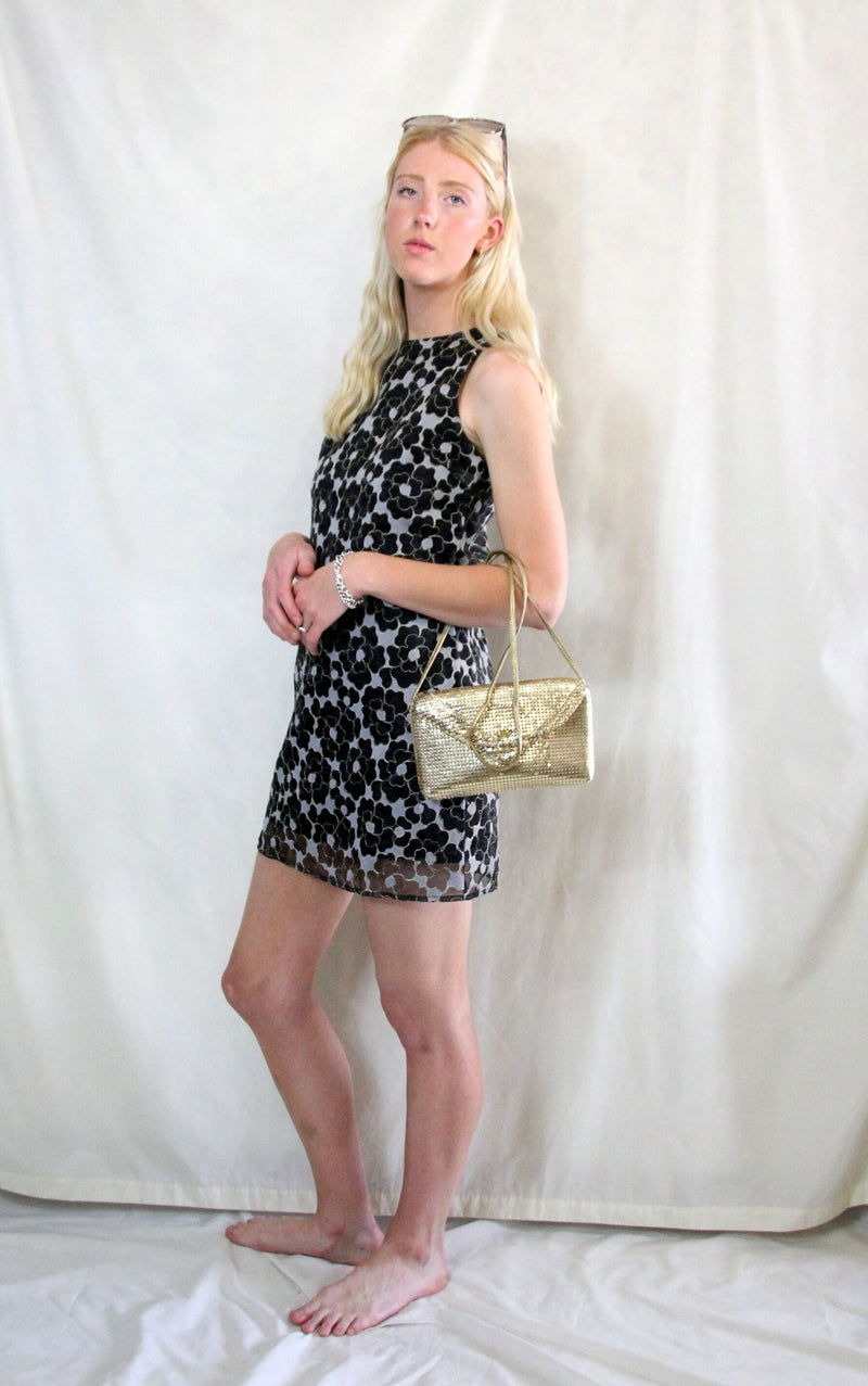 Rent 1960s style retro mini dress with large black and cream floral print