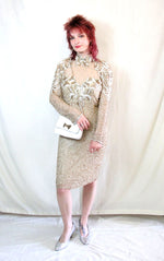 Rent one of a kind sequin embellished bronze dress with long sleeves and built in bra cups. 