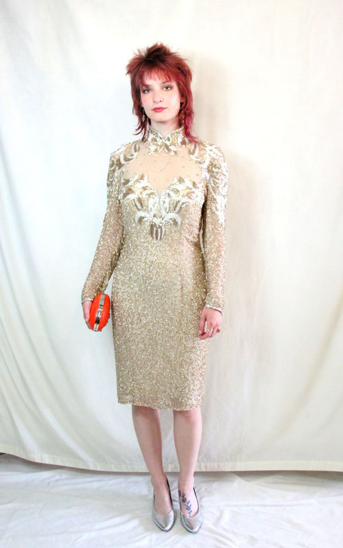 Rent one of a kind sequin embellished bronze dress with long sleeves and built in bra cups. 