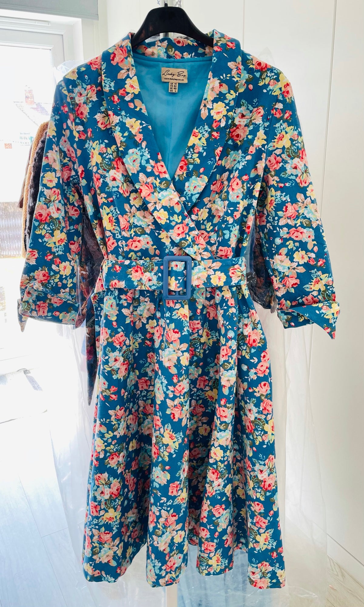 Rent Vintage and Pre-loved Floral Tea Dress Rent floral sky blue print 1950's style tea dress with matching waist belt. 