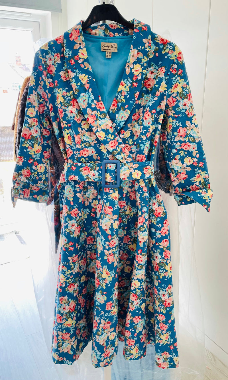 Rent Vintage and Pre-loved Floral Tea Dress Rent floral sky blue print 1950's style tea dress with matching waist belt. 